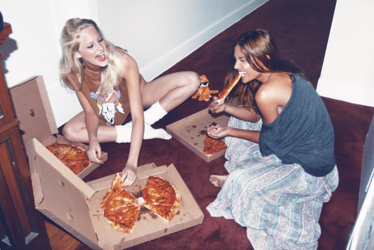 Two girls are eating