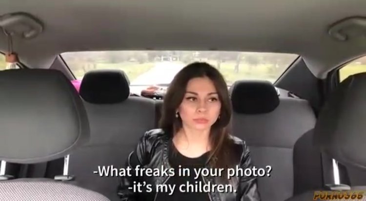 The girl pays the taxi driver