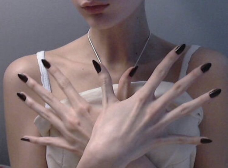 Female hands with long fingers