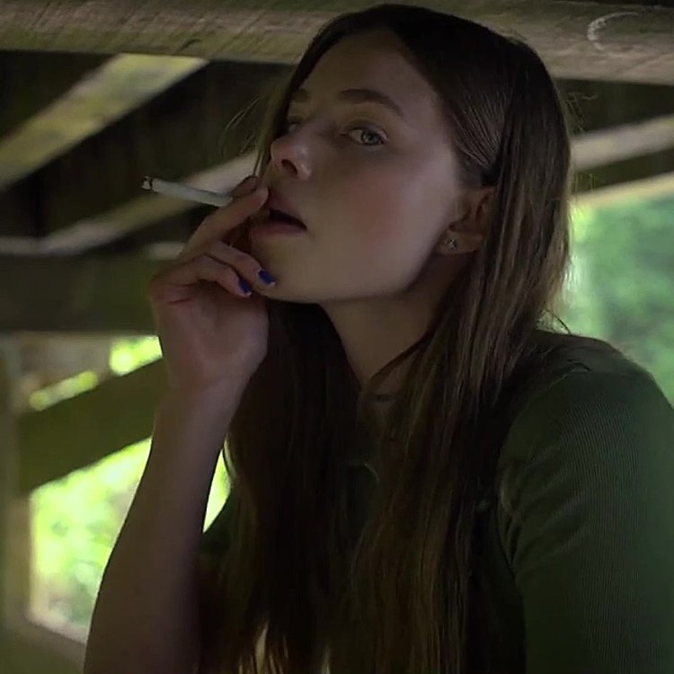 Christine Froset smokes