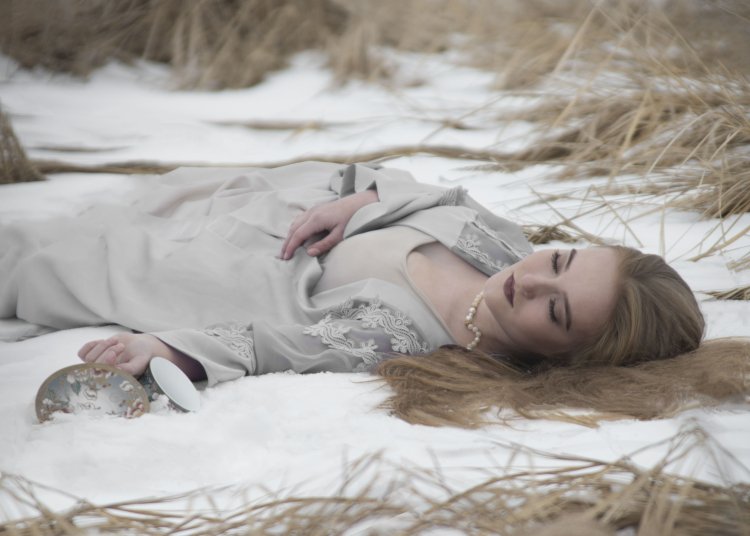 Girl lies on the snow