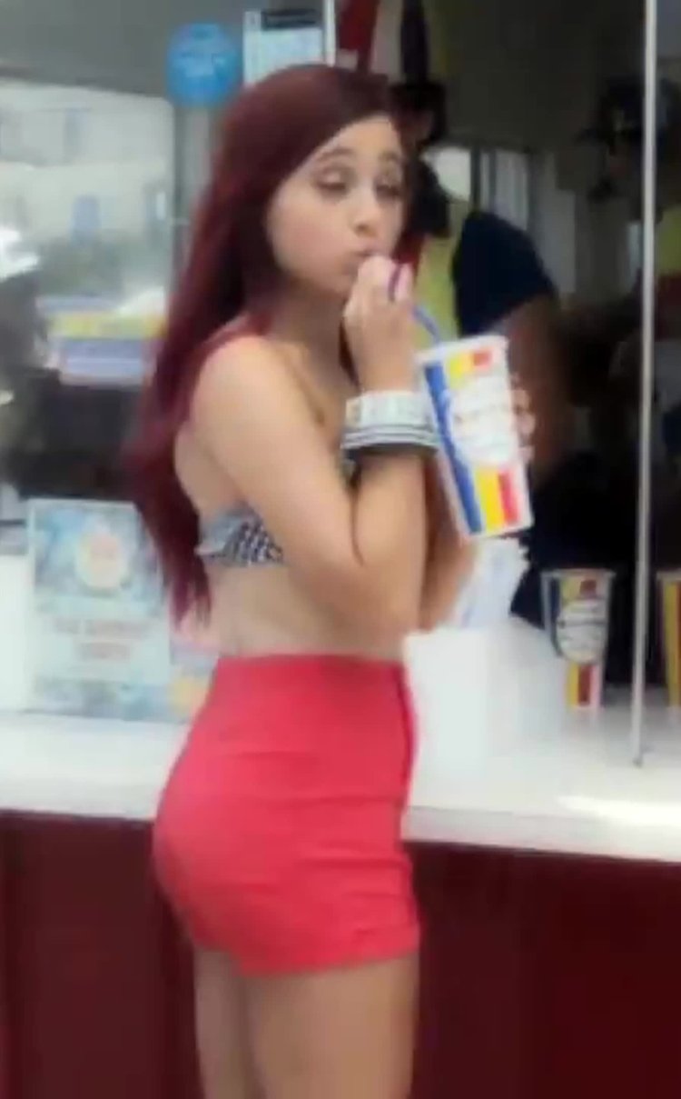 The girl in the dress leaned over