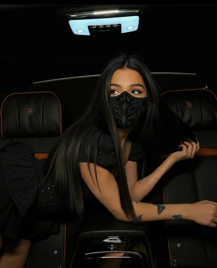 Amina Tenderlibai near the car