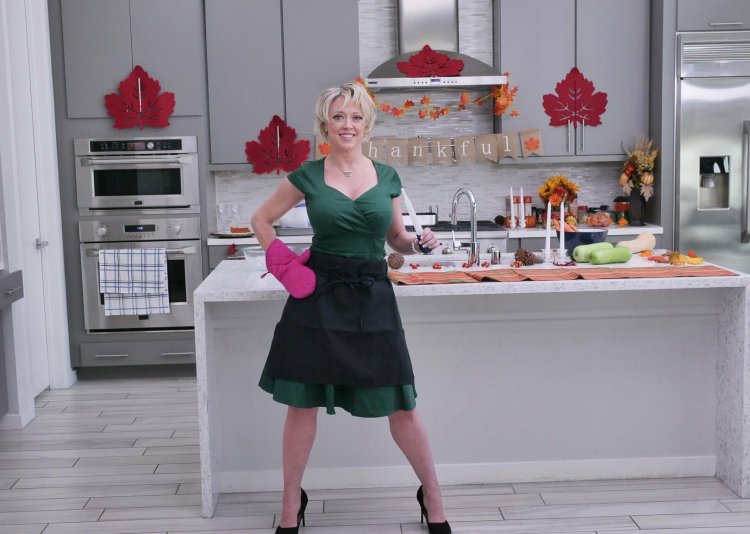 Dee Williams in the kitchen with chicken