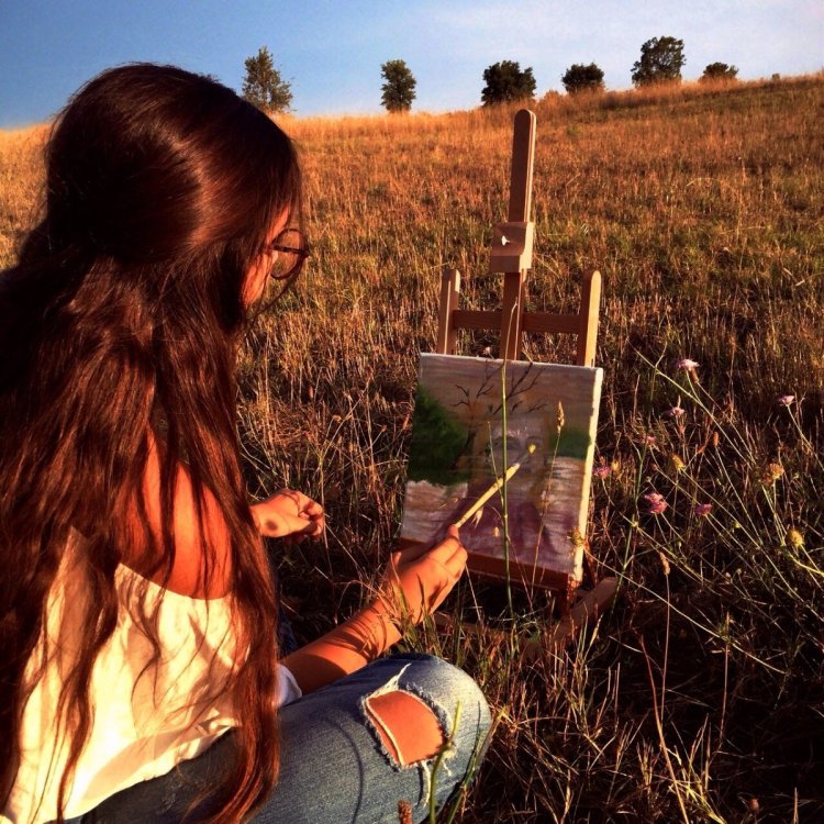 Girl with easel in nature