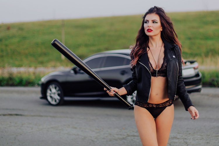 Beautiful girl with a bat
