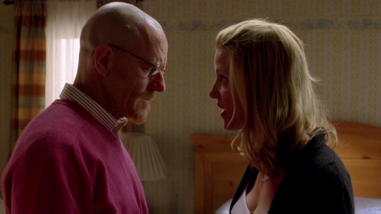 Brian Cranston and Anna Gann on the couch in all heavy