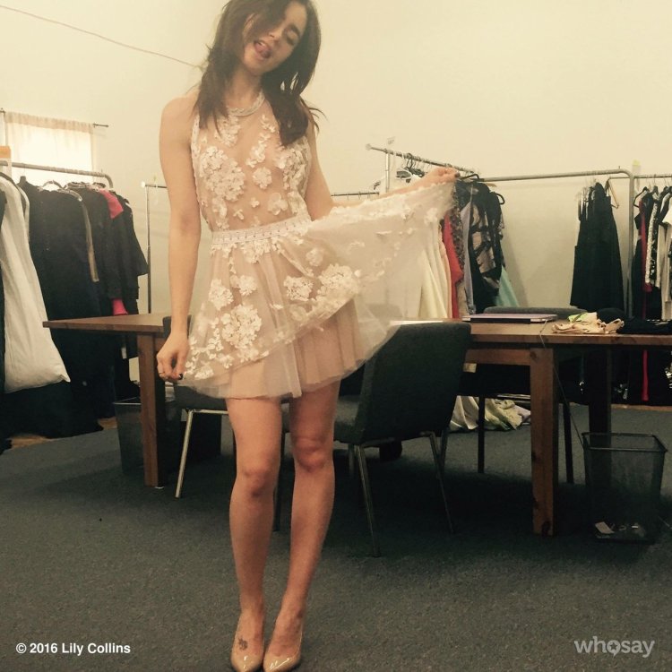 Lily Collins in a short dress