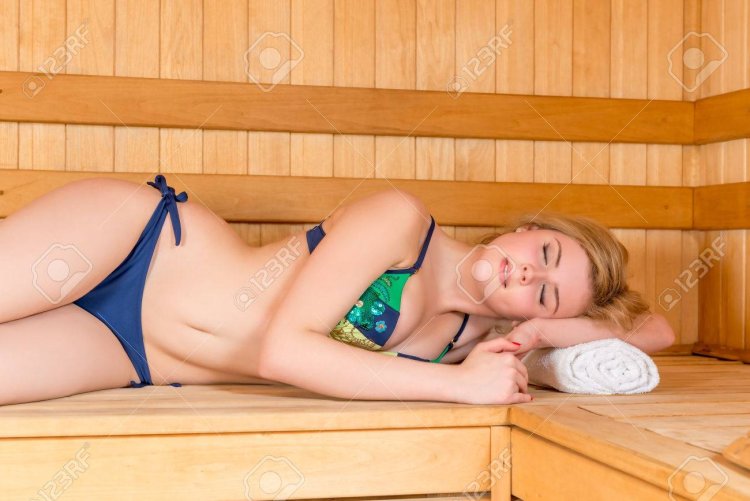 Sauna girl in a swimsuit