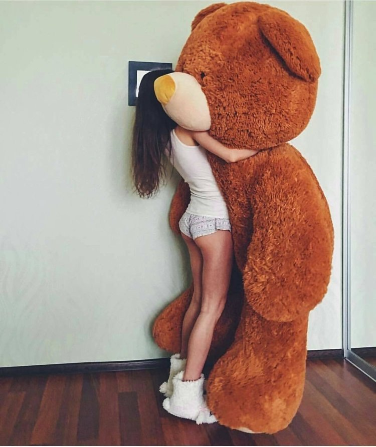 Girl and a huge plush bear