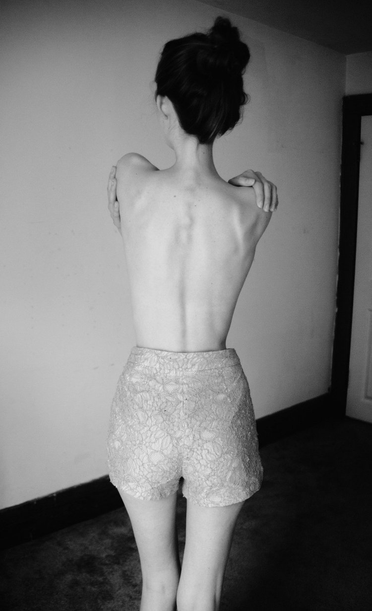 A thin girl from behind
