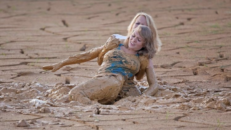 The girl crawls in the mud