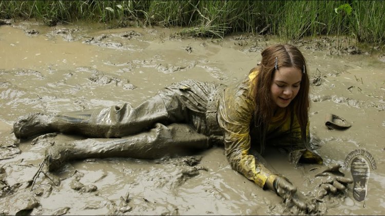 Women in Waders in Mud