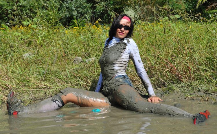 Girls in the mud in clothes