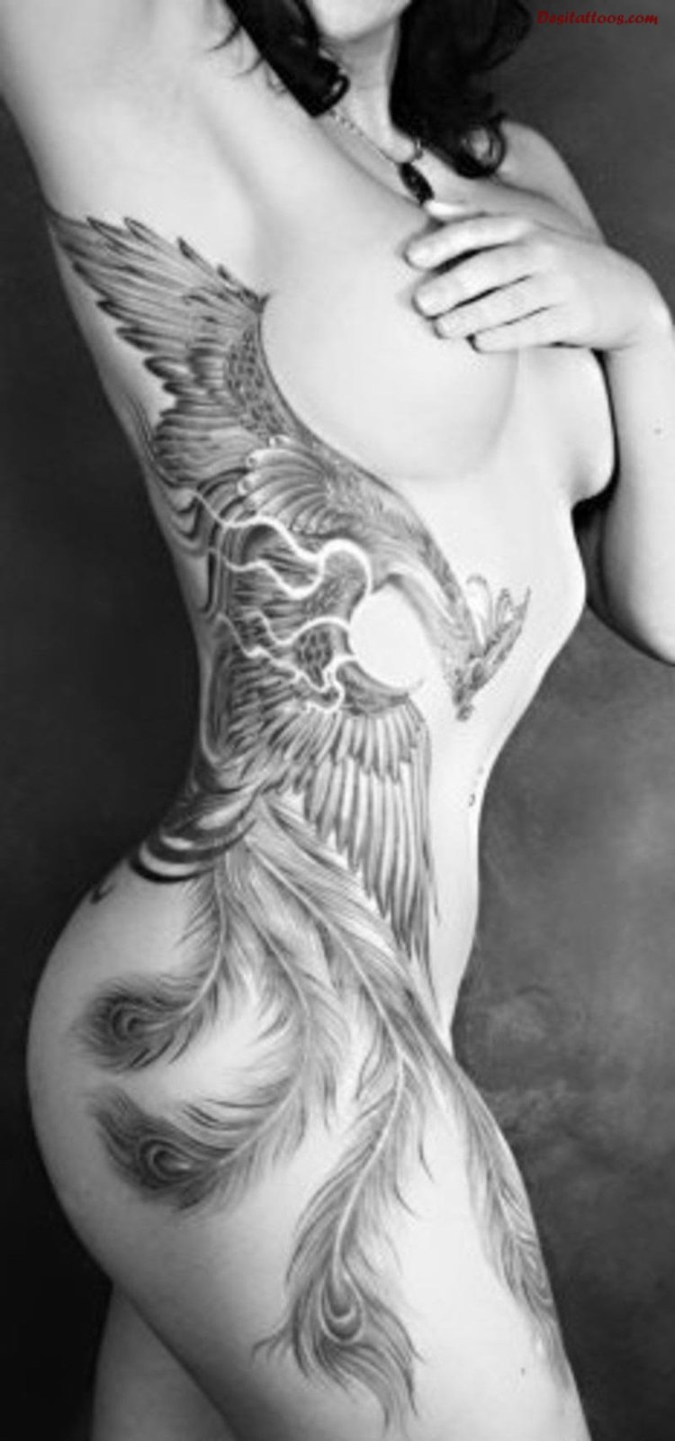 Tattoo bird Phoenix on the hip