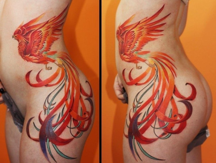 Tattoo bird Phoenix on the stomach