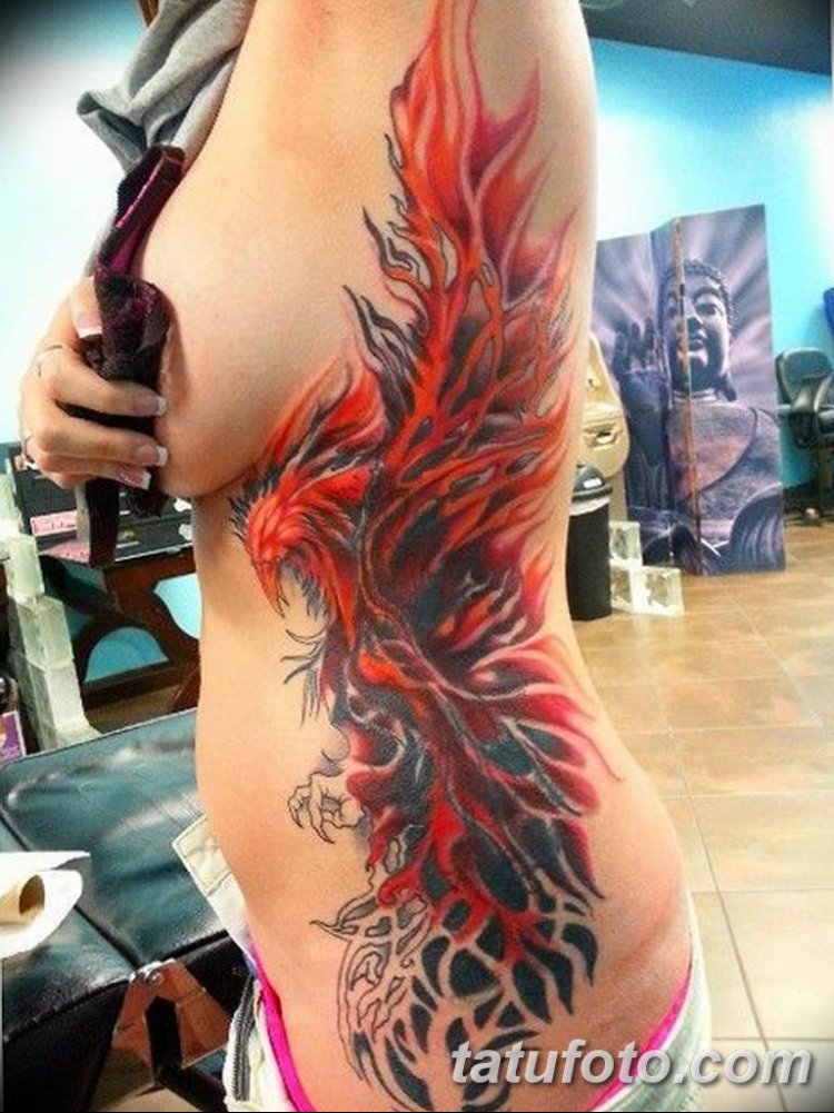 Tattoo Phoenix on the ribs of girls