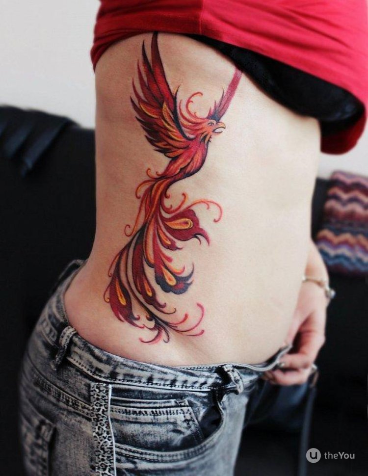 Tattoo phenix on the ribs