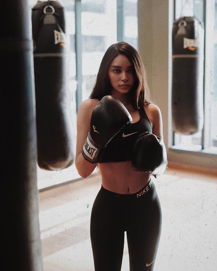 Brunette in boxing gloves