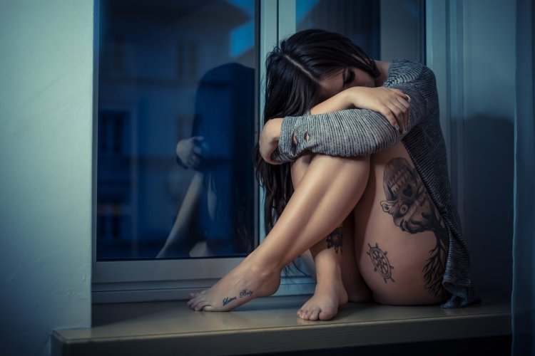 Brunette on the windowsill