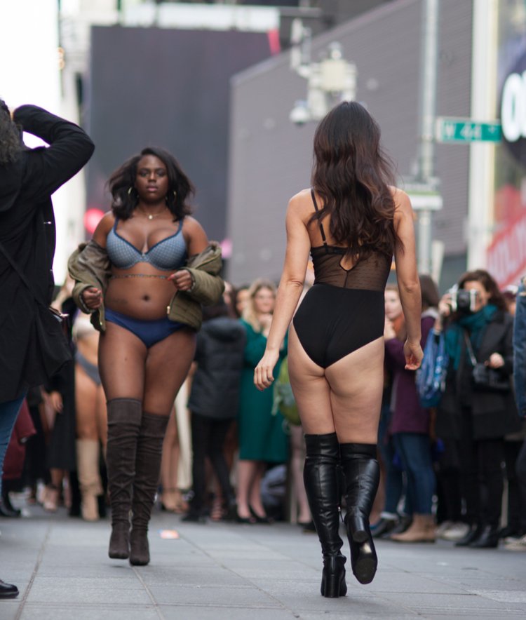 Woman undresses on the street