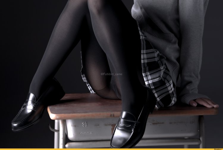 A woman takes off tights