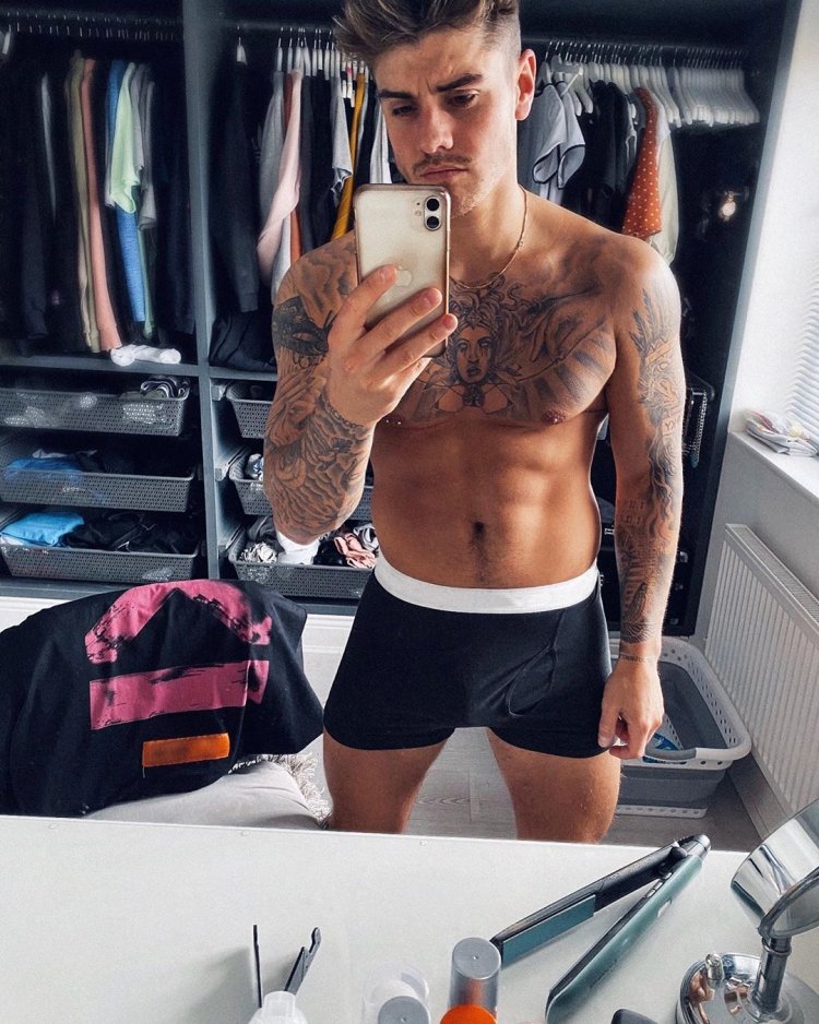 Guy with tattoo topless selfie