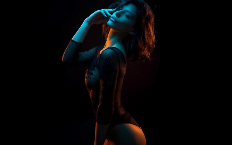 Girl in linen on a black background