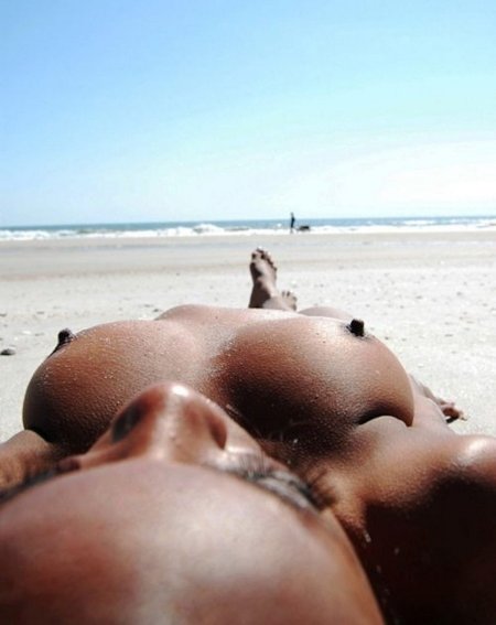 Big boobs sunbathe