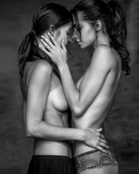 Naked women hug