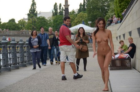 Naked Agnes walks along the street