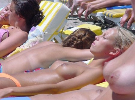 Girls sunbathe topless