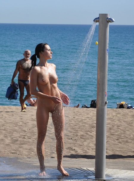 Naked beauties on a public beach