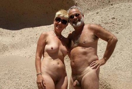 Naked mature married couples on the beach