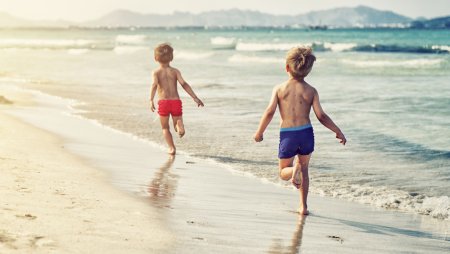 Boys play on the beach