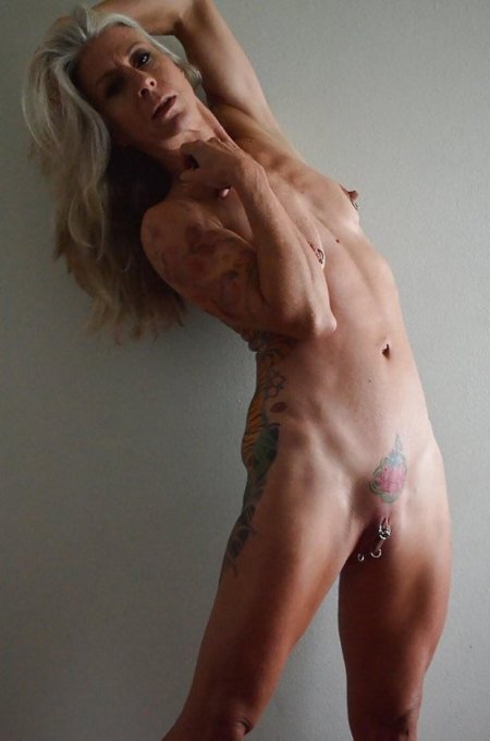 Naked thin mature with piercing