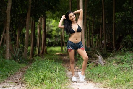 Busty undresses in the forest