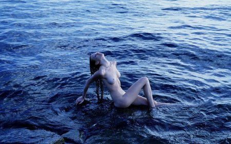 Completely naked with dolphin