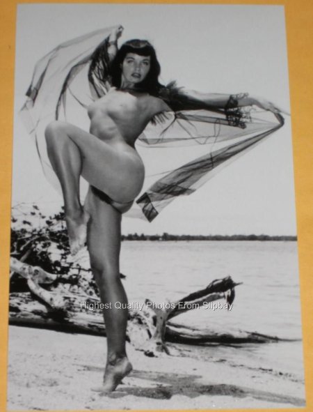 Bettie Page shows the vagina to a man