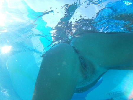 Asses of girls underwater
