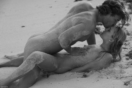 Naked couple on the shore